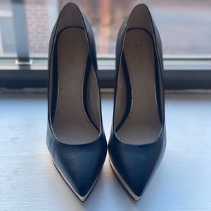 Black and gold platform pumps